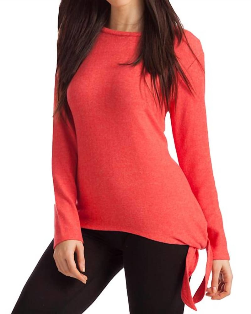 Front of a model wearing a size LG Ellie Side Tie Kashmira Sweater in Coral in Coral by french kyss. | dia_product_style_image_id:326892